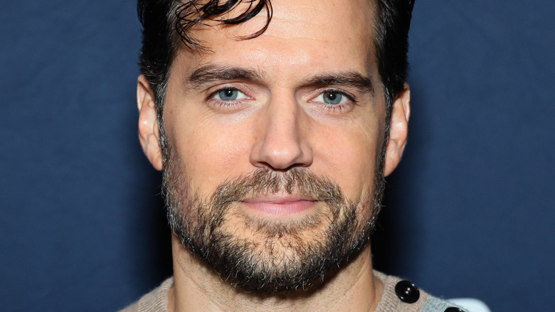 Henry Cavill smiling at premiere event
