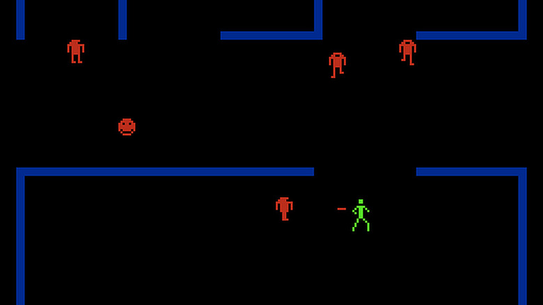 Red robots advance on the green player character in Berzerk (1980)