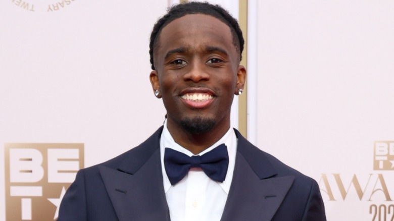 Kai Cenat wearing a suit and tie