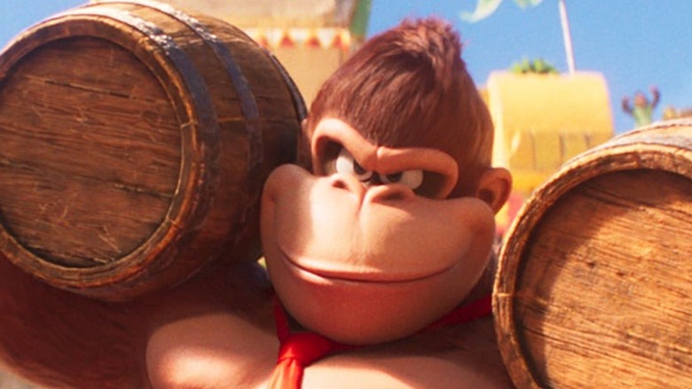 Donkey Kong lifting two barrels