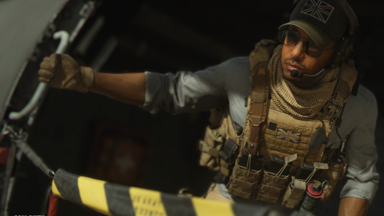 Soldier leaning from helicopter