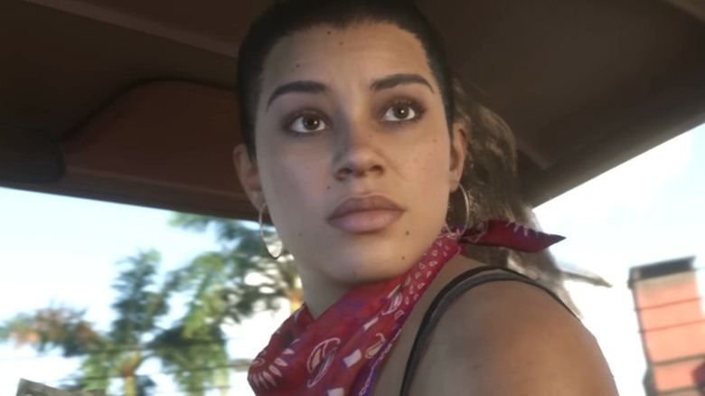 Lucia counting money in a car in Grand Theft Auto VI