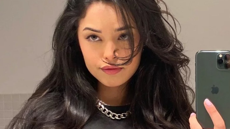 Valkyrae taking a mirror selfie with an iPhone