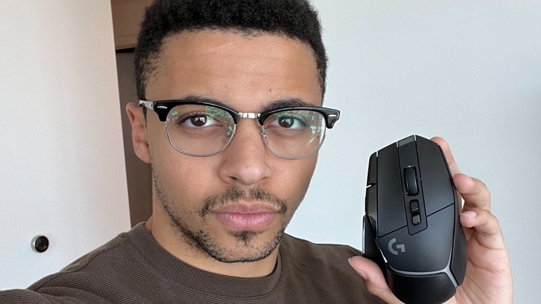 Myth holding a computer mouse