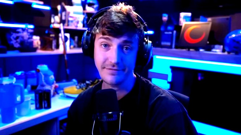 Ninja sitting in front of microphone