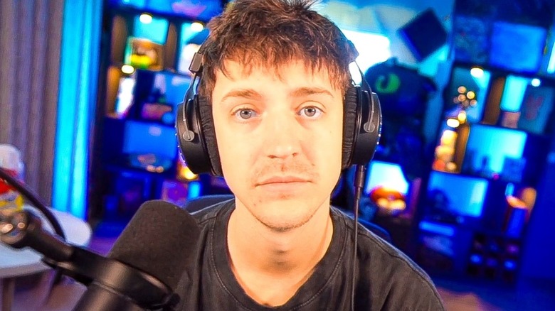 Ninja wearing headphones and looking into camera