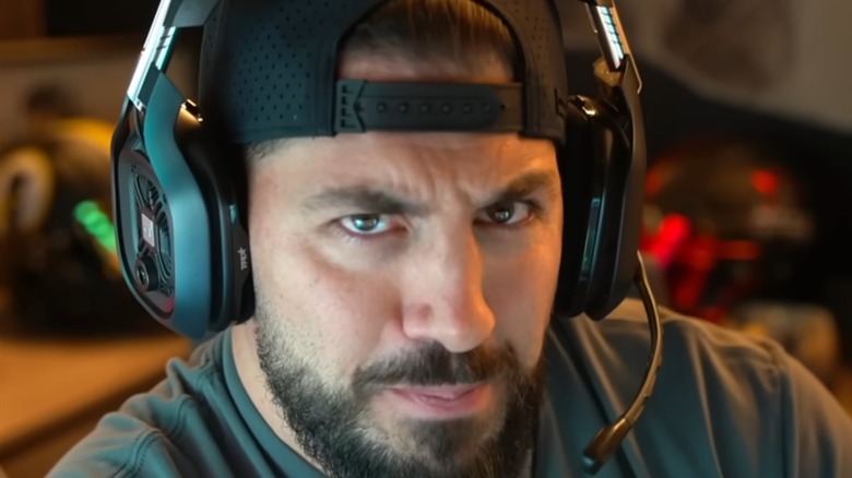 Nickmercs wearing headphones and looking into the camera