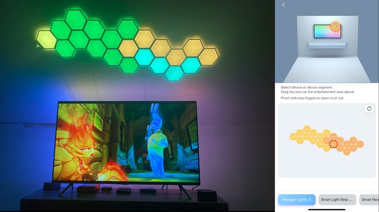 Linkind EP6 Smart Hexagon Panels displayed on a wall above an entertainment center, along with a screenshot of the app