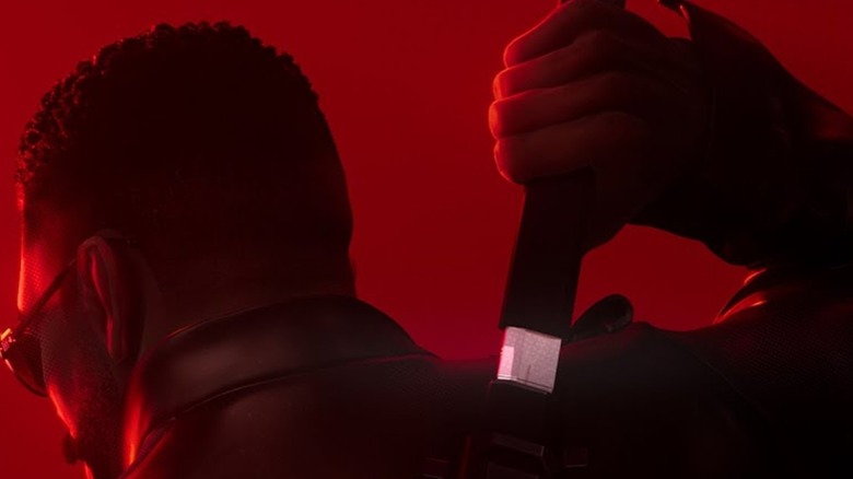 Blade unsheathing a sword on his back