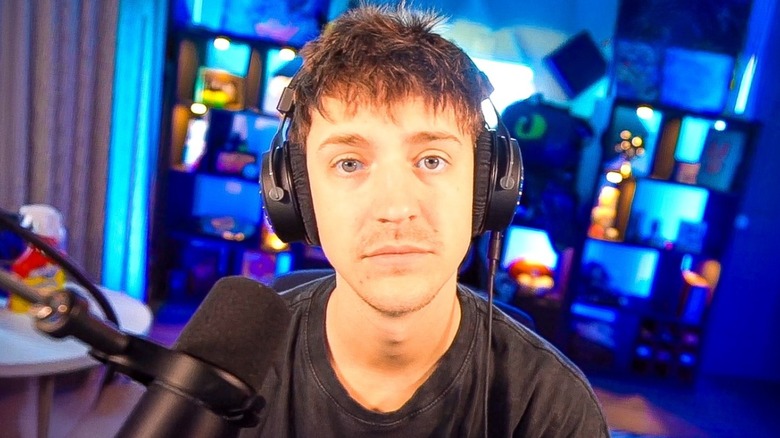 Ninja wearing headpones and looking into the camera