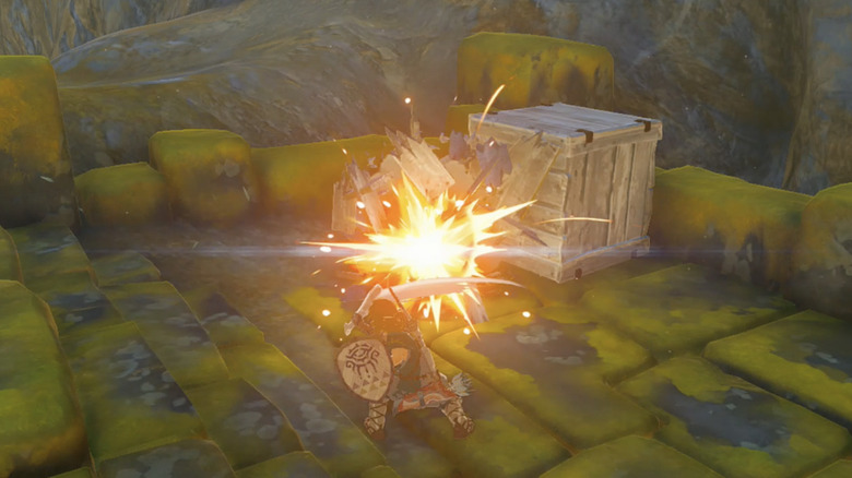 Link breaking wooden box with sword