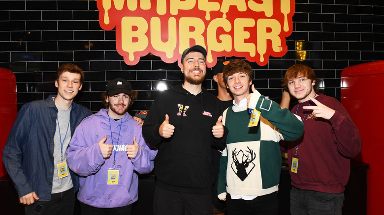 MrBeast posing with fans