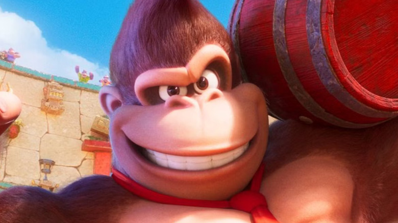 Donkey Kong flexing and holding barrel
