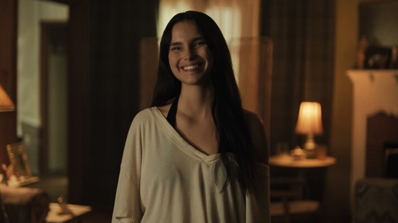 Nikki Freeman smiles unnaturally in "Obsession" (2026)