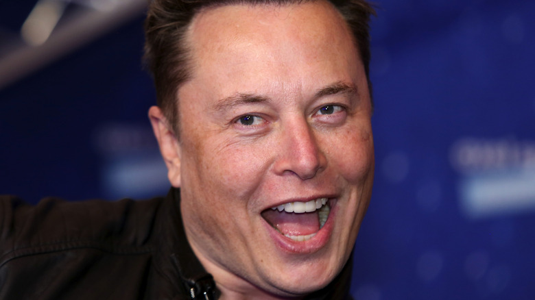 Elon cheesy smile