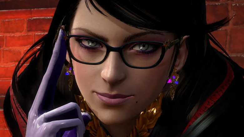 Bayonetta adjusts her rounded-square glasses while slightly smirking