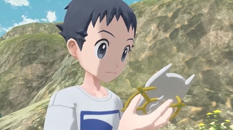 A pale boy staring at a white phone reading a message