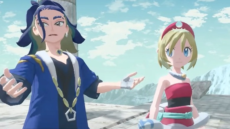 Adaman in blue and black talking haughtily to Irida in white and pink