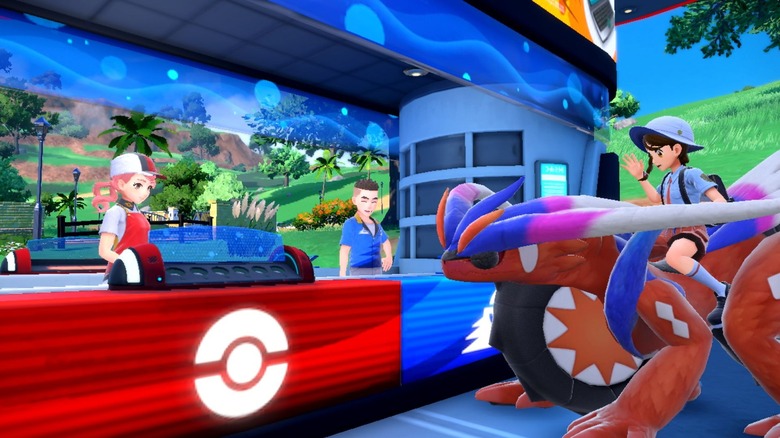 Pokemon trainer riding on Koraidon at Pokemon Center
