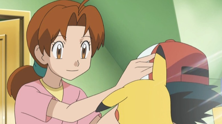 Delia adjusting Ash's hat