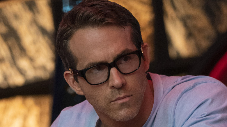 Ryan Reynolds as Guy wearing glasses in Free Guy