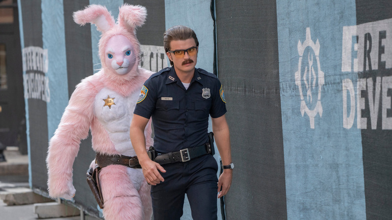 Utkarsh Ambudkar as Mouser in a bunny suit and Joe Keery as Keys with mustache in FREE GUY