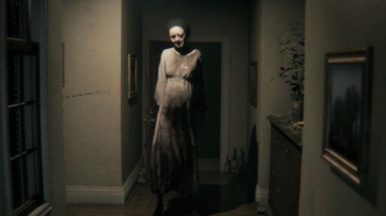 Lisa standing at end of hall PT