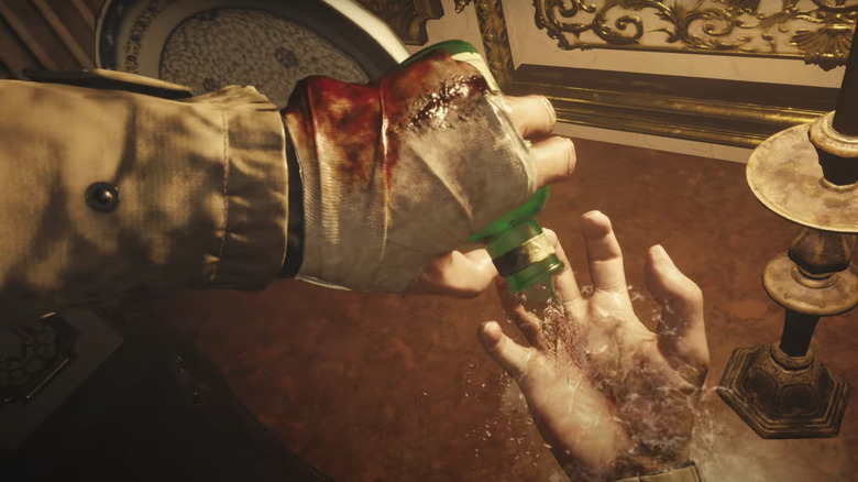Resident Evil Village Ethan pours med on hands