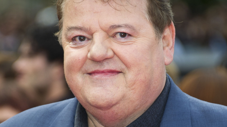 Robbie Coltrane smiles red carpet