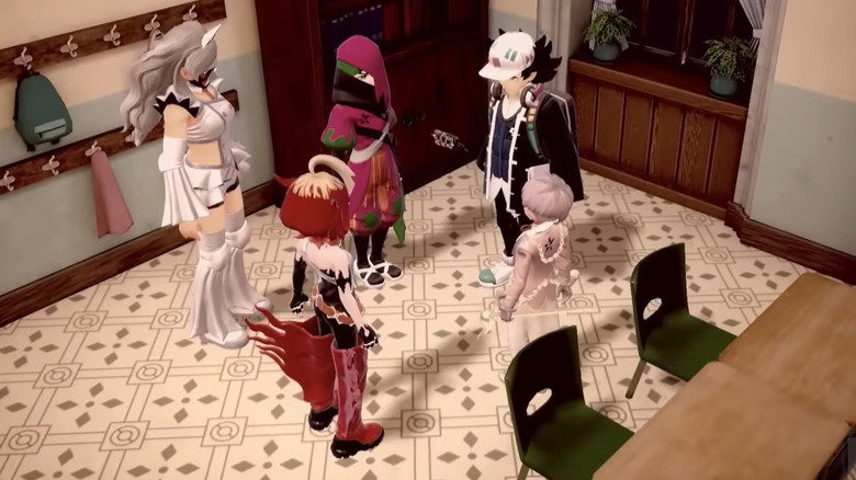 Trainers standing in a circle and talking