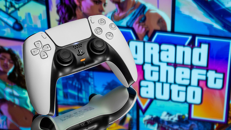 A PS5 controller in front of Grand Theft Auto graphics