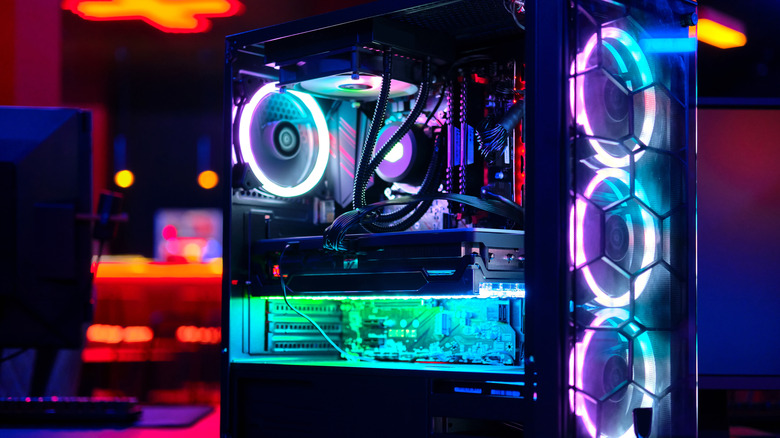 A see-through PC tower with many neon-lit elements