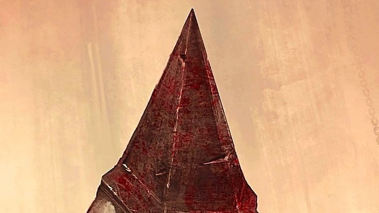 Pyramid Head standing with sword