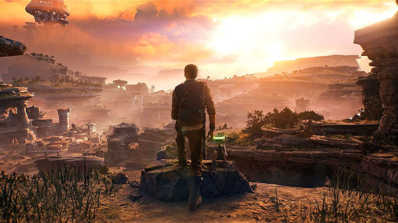 Cal standing on cliff looking out over horizon