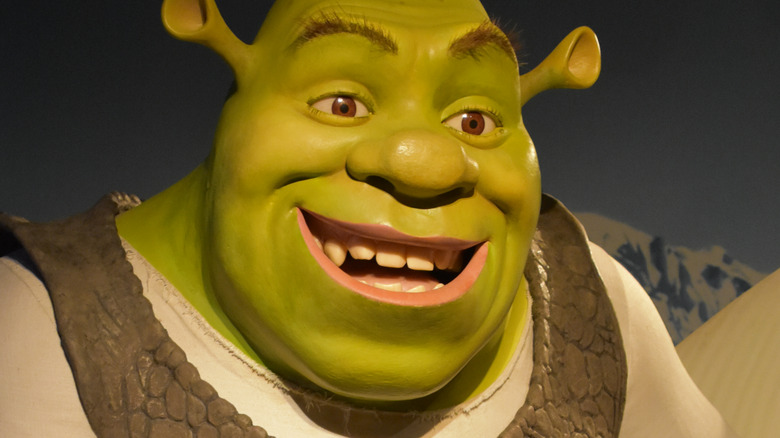 A menacing statue of Shrek stares down the viewer