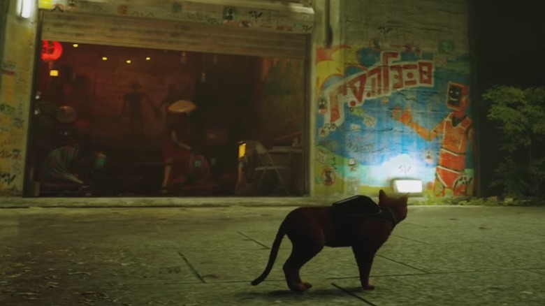 Cat looking at robot mural