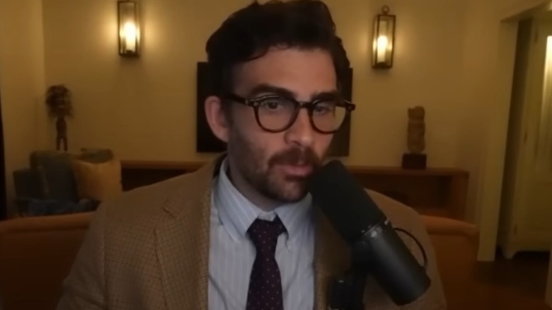 HasanAbi talking into a microphone
