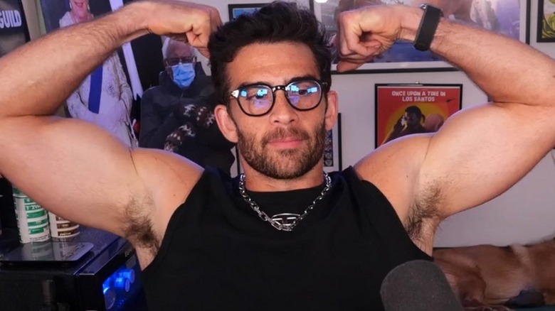 HasanAbi flexing in front of microphone