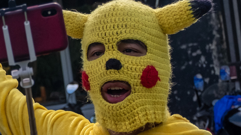 Man in Pikachu mask talks
