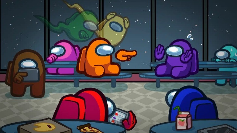 Among Us characters sitting in a lunch room