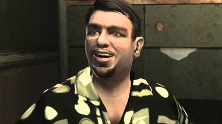 Roman Bellic smiling in his office in Grant Theft Auto 4
