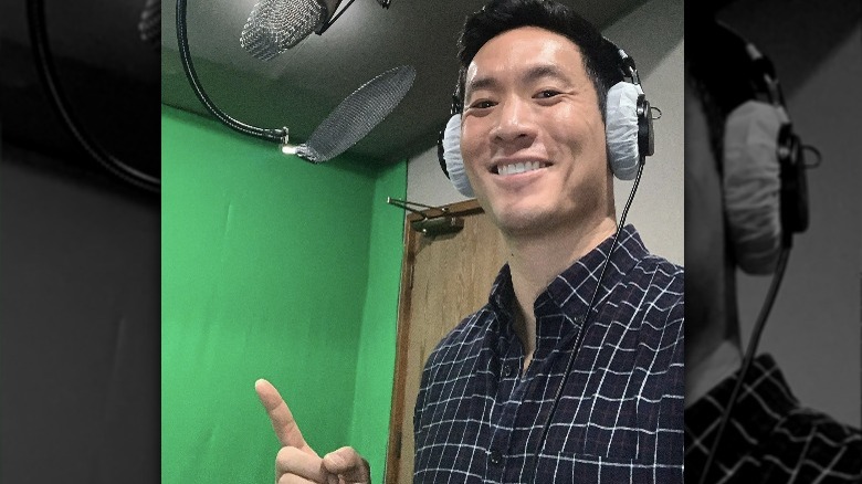 Stephen Oyoung posing at microphone 