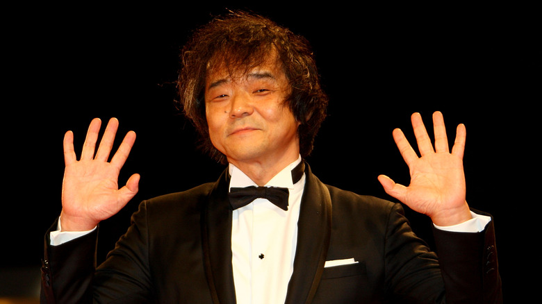 Mamoru Oshii hands up at premiere