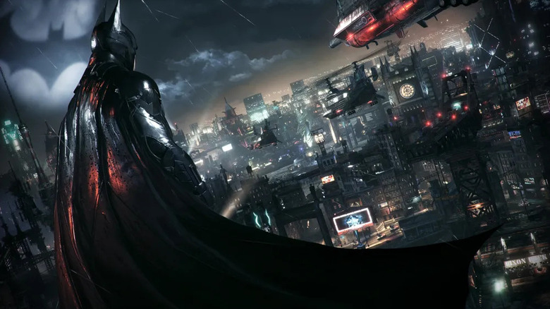 Batman surveys Gotham City in the rain in Batman: Arkham Knight