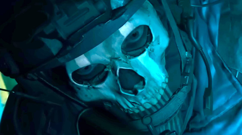 Soldier wearing skull mask and helmet