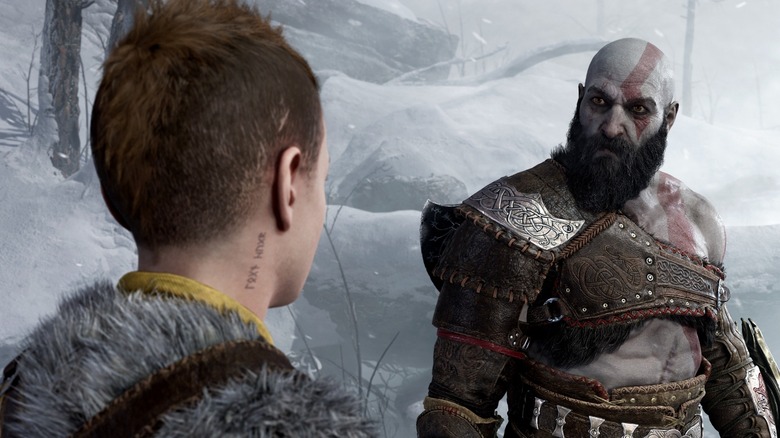 Kratos looking at Atreus in the snow