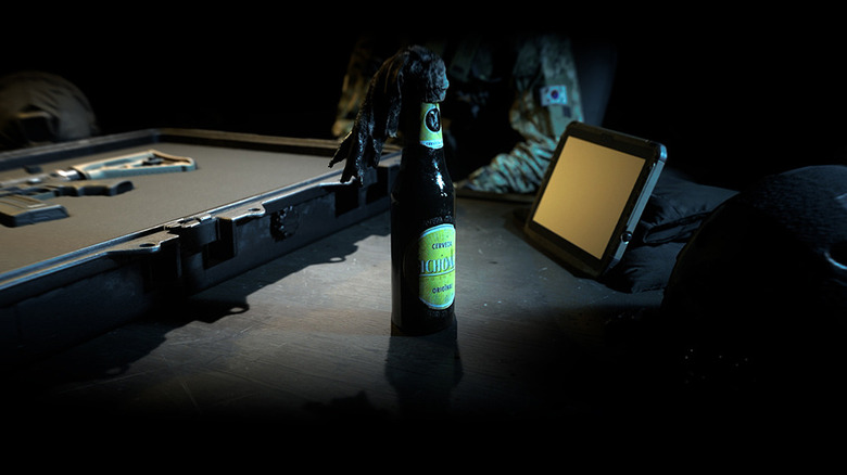 Molotov cocktail and weapon on table