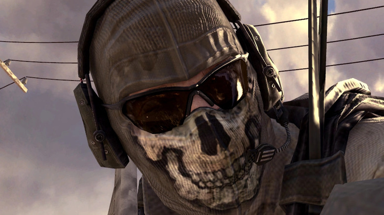 Operator wearing skull mask and headphones