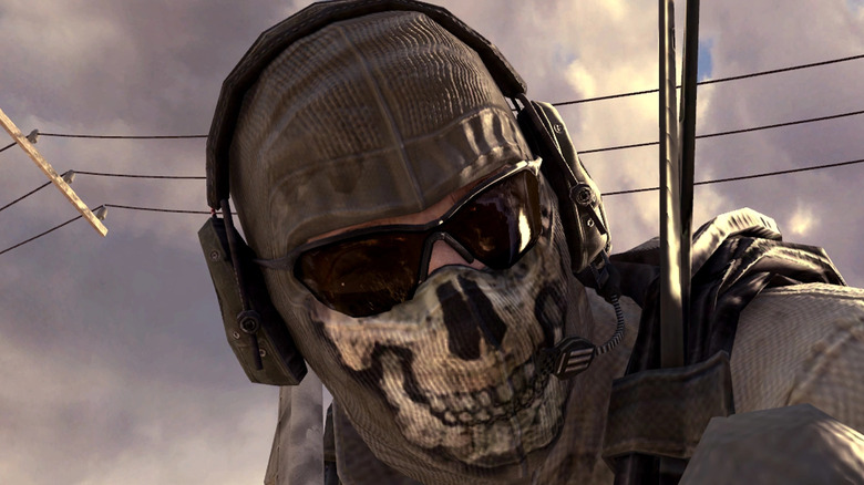 Operator wearing skull mask and headphones