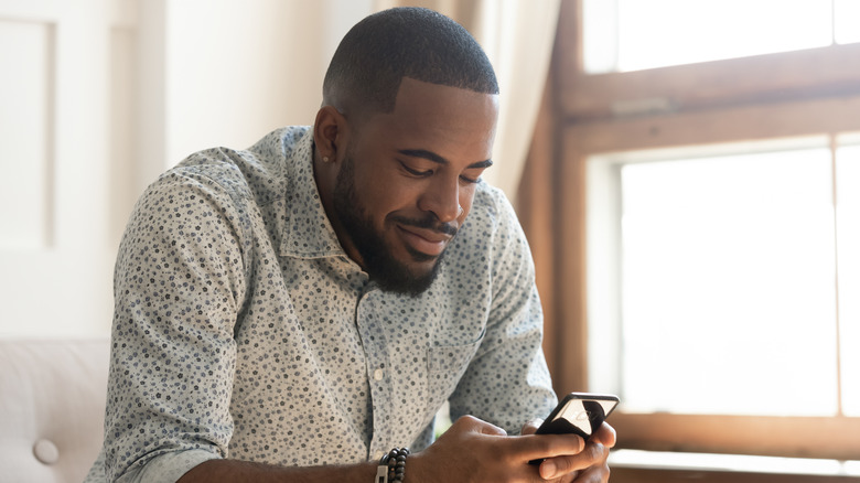 Man playing mobile game